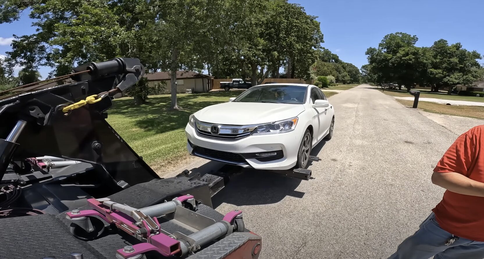 Roadside assistance technician helping stranded motorist