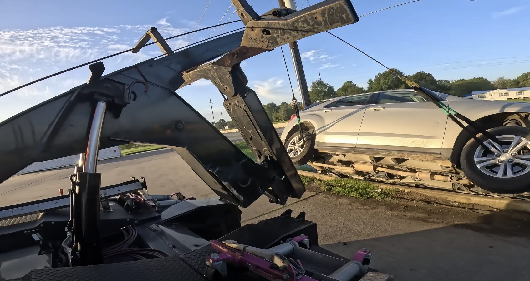 Professional long-distance towing truck preparing for interstate vehicle transport